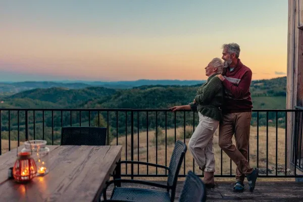retired couple enjoying the sunset